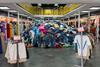 An image showing piles of clothes in a store
