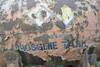 A rusty tank with phosgene written on it
