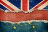 Torn flags of the UK and EU flag