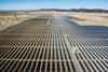 An image showing solar panels in the desert