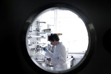 An image showing a researcher framed by a round window