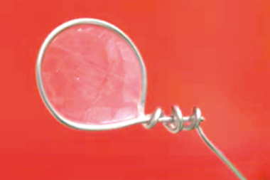 An image showing the freestanding nanofilm held by a 4 cm diameter steel ring