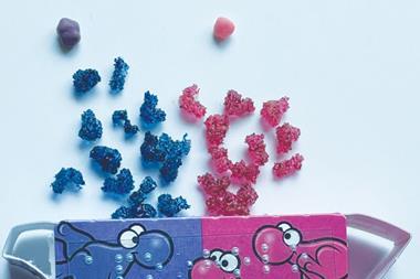 An image showing a number of pink and blue blob-like protein sweets spilling out of a Nerds package