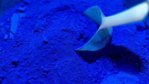 Scoop of ultramarine blue color pigments 
